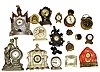 Seventeen small wind up clocks. Includes cast metal novelties, hand painted and bright orange Chinas, alarms, heavy iron with figural bird, etc.