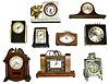 Nine plug in electric clocks. Includes 2 Sangamo, a Hammond calendar, McClintock time switch, Sessions marble, Ingraham pillar and scroll, GE refrigerator, etc.