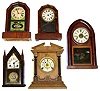 Five wood case shelf clocks. Includes Waterbury beehive, 2 octagon tops, small steeple with bold eagle glass, and Fattorini English alarm oak.
