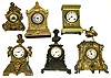 Six Connecticut cast metal mantel clocks. 2 Seth Thomas' Sons, 1 Ansonia Brass Co, 2 figurals and 1 architectural.