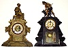 Two large cast metal figural clocks. One is a Kroeber with barrel pendulum and well done man and dog atop. A classical lady seated with her jewelry box adorns the other.