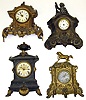 Four Connecticut 8-day cast-metal mantel clocks. Heavy detailed castings. Largest, with urn top and U.S. Clock Co. dial, is 19" high.