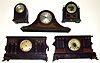 Five wood case Connecticut 8-day mantel clocks. Sessions 6 column, Gilbert tambour and lancet, Ingraham black with unusual front wind separate alarm movement, and Seth Thomas round top with 48J round plated spring movement