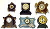 Six metal case 8-day Connecticut mantel clocks. Includes Seth Thomas alarm, Waterbury blue front with white applied figures, and Ansonia. Largest is 11" high.