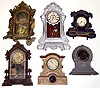 Six cast metal Connecticut 8-day clocks. Detailed castings. 1 iron front Tallest, painted silver, is 24" high.