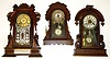 Three mahogany case 8-day Connecticut parlor clocks. One Kroeber with beveled glass pendulum, one Waterbury "Paris" with alarm. Tallest, with nice glass and lower floral panel and alarm, is 22" high.