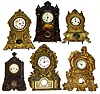 Six 8-day Connecticut iron fronts Large figural gold clock is N. Muller No. 67. One with bold floral and wood grain painting. Also examples by American Clock Co., U.S. Clock Co. dial with Terry and Edwards label, next to last in photo- Terhune and Edwards, NY, and a Waterbury -- the largest at 19" tall.
