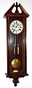 Vienna Regulator 8 day time and strike weight driven movement in a burled wood and ebonized case with subsidiary seconds on porcelain enamel dial, c1870
