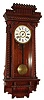 Ansonia Clock Co., New York, "Queen Anne" wall clock 8 day time and strike spring driven movement in walnut case with paper over metal dial, c1900