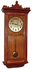 Eastman Clock Co., Boston "Regulator" wall clock 8 day time only weight driven movement in oak case with carved top and Corinthian style columns, matching beading above door and around base and solid brass dial with raised brass numerals, c1890