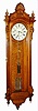 Seth Thomas Clock Co., Thomaston, Conn., "Regulator No. 19" wall clock 8 day time only weight driven movement with Mercury two-jar pendulum in oak case with burled highlights on top crest and raised burled panel on backboard with painted metal dial, c1886
