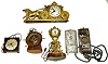 Five electric clocks. Includes Waltham yacht wheel, Big Ben in Bakelite case, United coach and post, and GE City of New York Astronomic Time Switch. Tallest is 12" high.