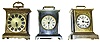 Three traveling clocks with top handles. Best and oldest is Seth Thomas striker with seconds bit and embossed front mask. Other 2 are modern Germans, one with alarm and other is Mercedes with MOP inlays. Tallest is 8" high.