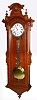 Kroeber Clock Co., New York, "Swiss Regulator No. 27" wall clock 8 day time only weight driven movement with pinwheel escapement in mahogany and burled mahogany case with porcelain dial and sweep seconds hand, c1882
