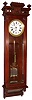 Wm. L. Gilbert Clock Co., Winsted, Conn., "Regulator No. 18" wall clock 8 day time only weight driven movement in mahogany case with porcelain enamel dial and sweep seconds hand, and 3-jar mercury pendulum (less mercury) c1901