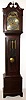 American, for Tiffany and Co., New York 8 day, quarter chiming, 3-weight, playing Westminster tune on 5 tubes in a mahogany case with reeded corner columns on both the broken arch hood with center final and the trunk. Has Durfee chime tubes. The silvered and brass dial has moon phase, serpentine hands, silent / chime selector, raised brass numerals and intricately cut and applied floral spandrels and center, c1900