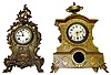 Two Connecticut heavy cast-metal 8 day mantel clocks. Shorter is New Haven with enamel dial and beveled glass. Larger gold urn top is 20" high.