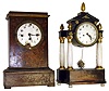 Two Austrian 19th Century 2 day mantel clocks. Inlaid wood cabinet clock has 3 train movement. Ebonized wood and alabaster columns portico clock is 18" tall.