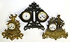 Three French cast metal 8 day mantel clocks. Two are ornate gilt figurals with reeded drum movement holders. Third is strut style weather station with twin scale thermometer, aneroid barometer with "Vebanderlyk" etc. readings, and bell strike movement with tic-tac pendulum, 14" tall.