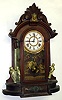 Ansonia "Triumph" mirror side walnut case with Kroeber 8 day movement.