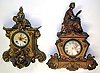 Two Connecticut cast metal 8 day figural mantel clocks, c. 1870. Detailed castings in old finish, shorter clock's top statue not attached and may belong to a different model. Both have replaced paper dials. Standard open spring striking movements will need service. Tallest clock is 21" high.