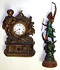 Two cast metal figurals including one complete clock and one swinger statue only, c.1880. Clock, with standing lad, fish, etc. has 8 day striking Connecticut movement and replaced paper dial. Standing spear toting lady has old green and gold paint, cracked wood base, 26" tall.