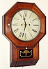 Atkins Clock Co., Equalizing Spring 30 day fusee wall timepiece, with ripple molded accents. C. 1860.