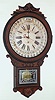 Gilbert Clock Co., Winsted, Conn. Office Drop Calendar walnut 8-day time-only wall clock, c1881.