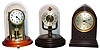 Three- Poole, Barr, Bulle; electromagnetic battery powered mantel clocks, early 20th century, 11" high.