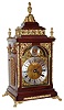 English, Smith and Sons, London, 3-fusee, quarter chiming bracket clock, mahogany case with arched dial, cast spandrels and applied silvered chapter ring. Chimes the quarters on a nest of 8 bells (choice of tune), and strikes the hour on a large cathedral gong, c.1900