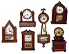 Six Burroughs wood novelty clocks.