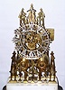 English Skeleton Clock 2-fusee, striking on a gong, attributed to Wm F. Evans of Handsworth (near Birmingham), movement with a vertical platform/lever at the top of the front plate, the clock on a rectangular marble block, mounted to a movement veneered base, with a larger rectangular dome of the period on a still larger veneered / inlaid base, c1865