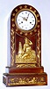 French, Empire style mahogany mantle clock, featuring a central frieze with a bare breasted maiden next to an obelisk surmounted by a globe. The base of the case with Egyptian themes, two sphinx with the head of Cleopatra. Bell strike movement has silk thread suspension. Dial signed LaPlace, Paris, c1840