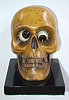 German, Oswald Uhrenfabrik, "Skull" of carved wood, telling time with rotating eyes; time in photo is 1:30; minutes showing to the right, c1935