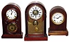 Three Connecticut 8 day time and strike mahogany round top mantel clocks.
