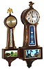 Two mahogany 8 day banjo clocks including a Herschede miniature and New Haven chiming, early 20th century