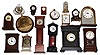 Sixteen-clock box lot, mostly small quartz novelties and a few windups, late 20th century.