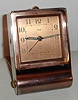 Jaeger Swiss Art Deco alarm travel clock in copper finish fold away case with Arabic numeral metal dial, c1925