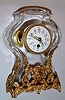 French, 8 day lever movement, glass with gilt mountings table timepiece, surmounted by the bust of a young man, c1900