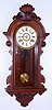 Ansonia Clock Co., New York, "Queen Mab" wall clock 8 day time and strike movement in walnut case, c1904