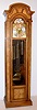 Howard Miller, Zeeland, Michigan, modern tall clock 8 day time, strike and chime on 9 tubes with option for Westminster, Whittington or St. Michael's tune weight driven movement in hard wood case with silvered metal dial with moon phase and applied brass numerals and spandrels, c1995