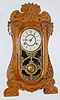 New Haven Clock Co., New Haven, Conn., "General" 8 day time and strike spring driven oak gingerbread clock, c1895