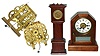 Five piece clock lot: Seth Thomas time/alarm; Waterbury long case German cuckoo, and 2 weight-driven 8-day striking movements, late 19th century.