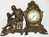 Ansonia Clock Co., New York, "Racine" figural mantel clock with 8 day time and strike spring driven movment in bronze finish cast metal case, c1901