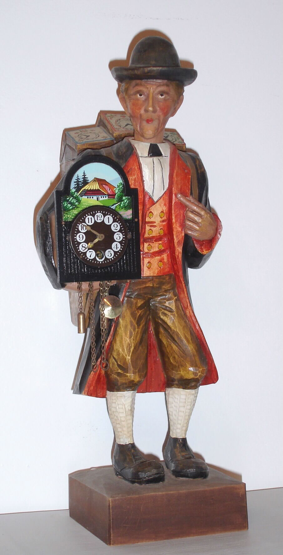 German, Clock peddler / whistler, holding a running clock and whistling a lively tune at will, c1970 — Antique Clocks Price Guide