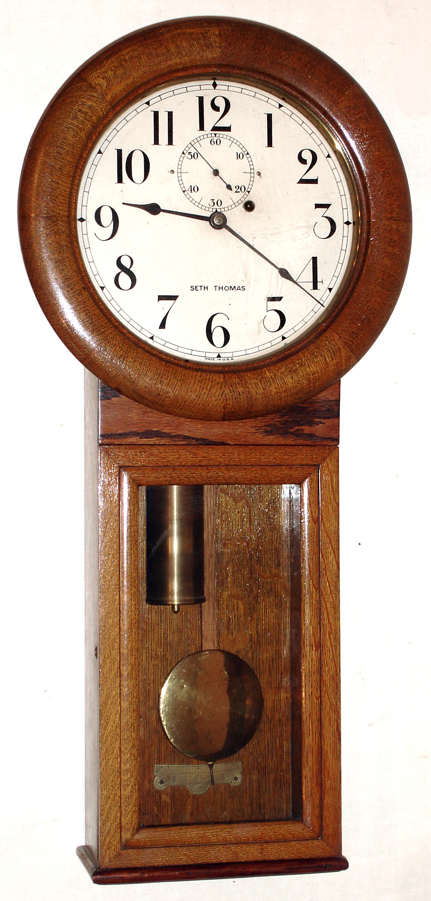 Seth Thomas Clock Co., Thomaston, Conn., "Regulator No. 2" wall clock, 8 day time only weight driven 77B movement with maintaining power, in oak case, c1930 — Antique Clocks Price Guide