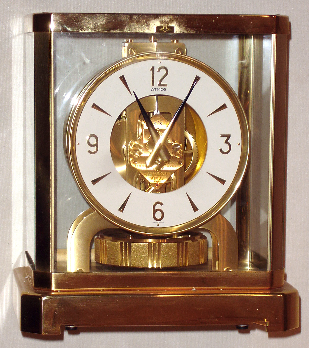 Jaeger-LeCoultre Swiss "Atmos" table clock, jeweled movement runs on changes of atmospheric pressure and temperature, gold-plated brass and glass case, serial number 562373, c1975 — Antique Clocks Price Guide