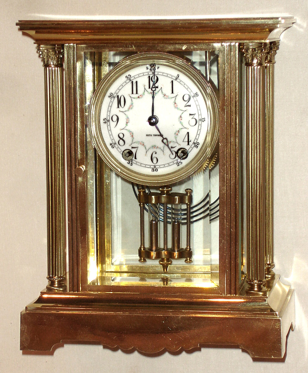 Seth Thomas Clock Co., Thomaston, Conn., "Empire No. 64" crystal regulator, 8 day time and strike spring driven movement, polished brass and glass case, c1908 — Antique Clocks Price Guide