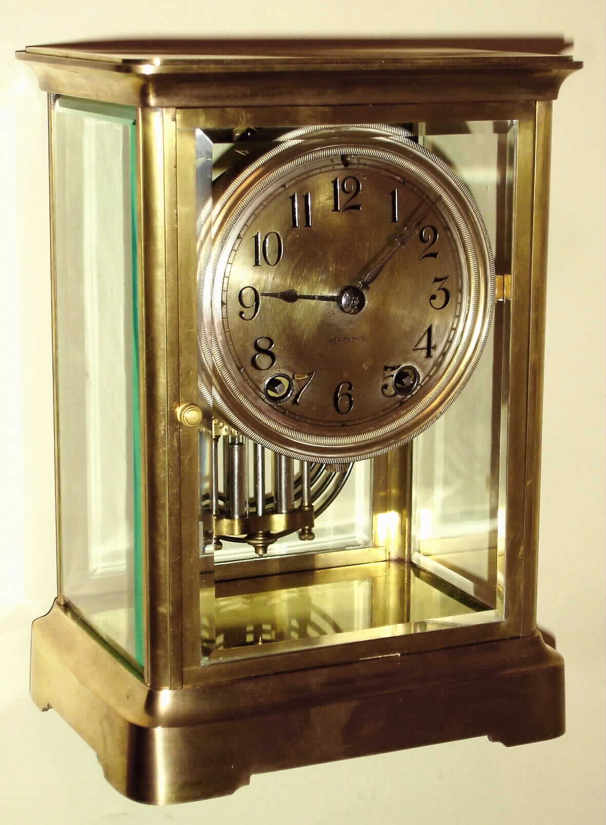 Seth Thomas Clock Co., Thomaston, Conn., "Empire No. 300" 8 day time and strike brass and glass crystal regulator, c1917 — Antique Clocks Price Guide