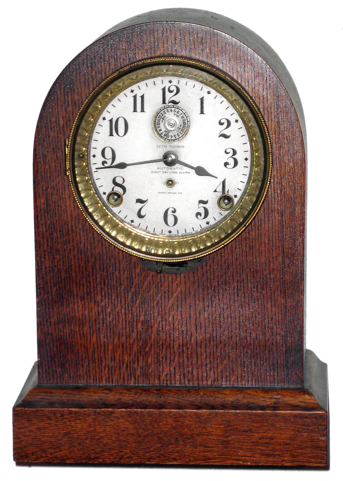 Seth Thomas Clock Co., Thomaston, Conn., "Automatic Eight Day Long Alarm" oak round top mantel clock, c1920 — Antique Clocks Price Guide